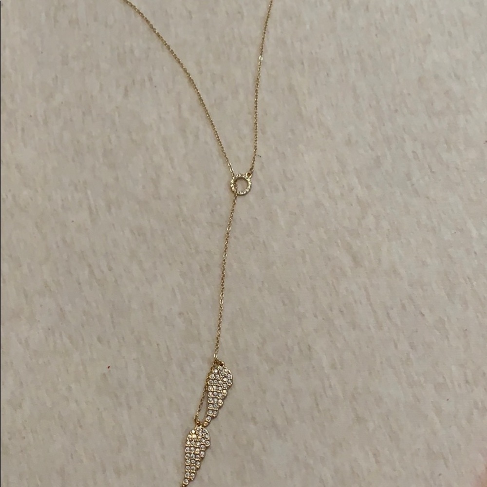 A gold angel necklace.